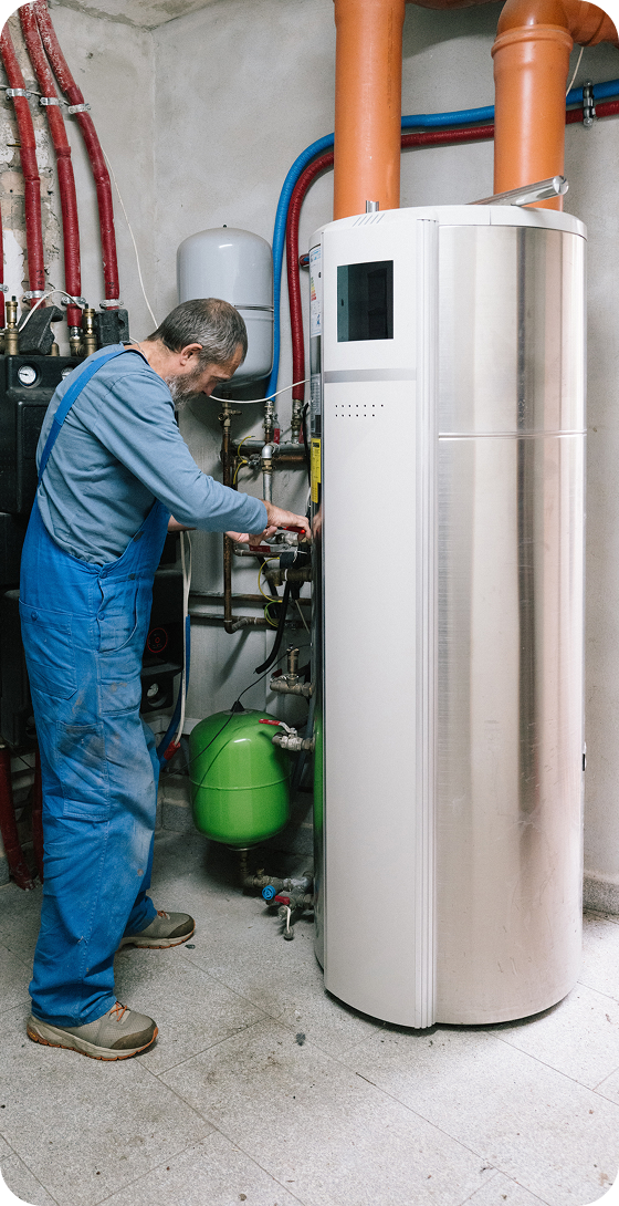 Man servicing boiler unit