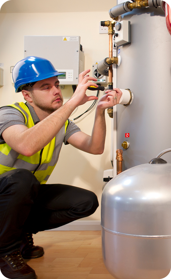Engineer adjusting machinery settings